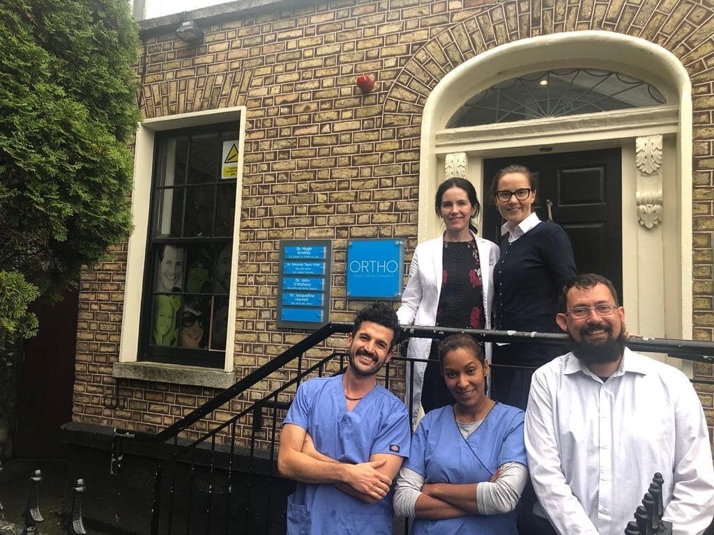 5 staff, team photo outside the Ortho.ie practice in Ballsbridge, Dublin.